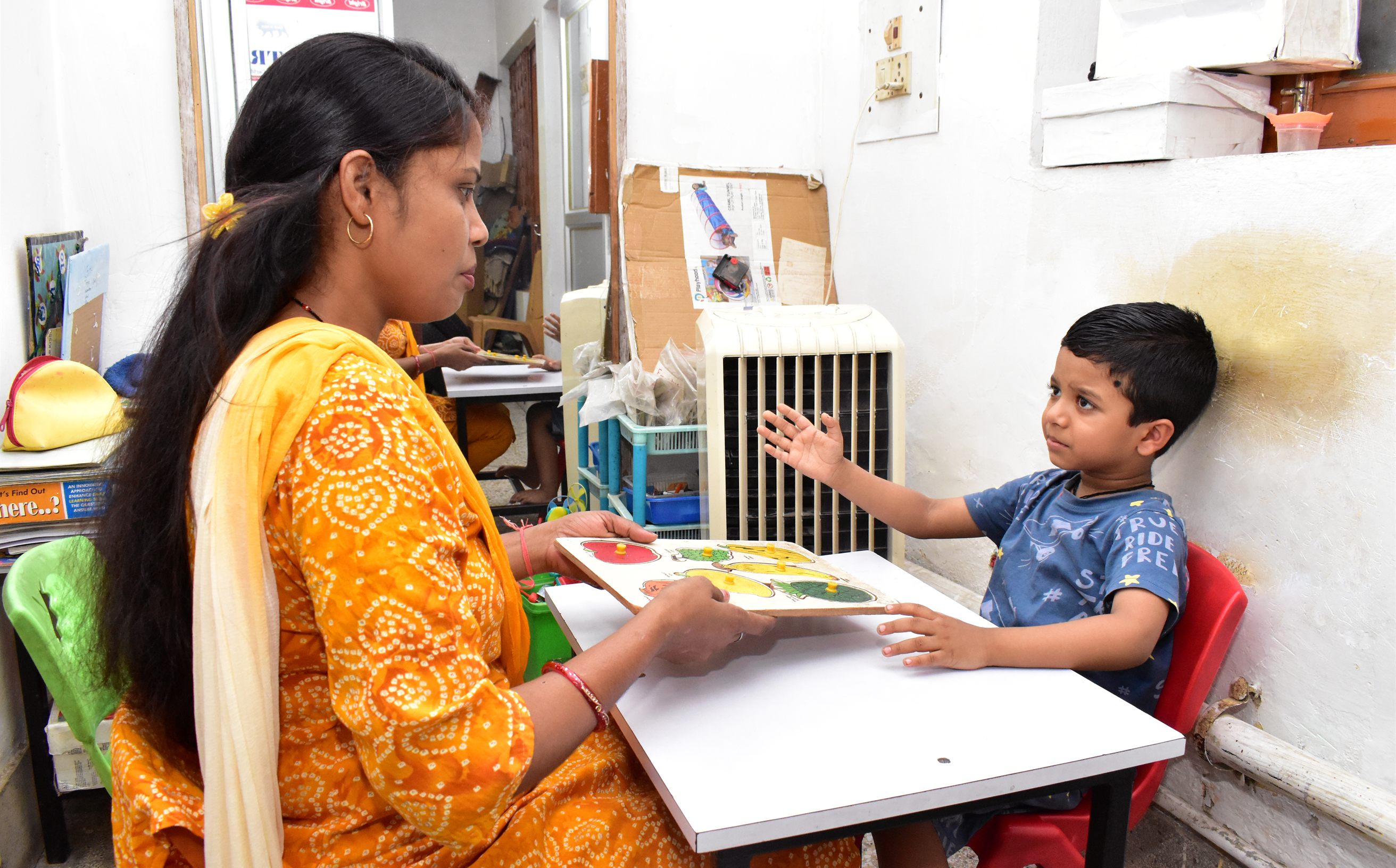 A child engaged in ABA therapy with visual aids