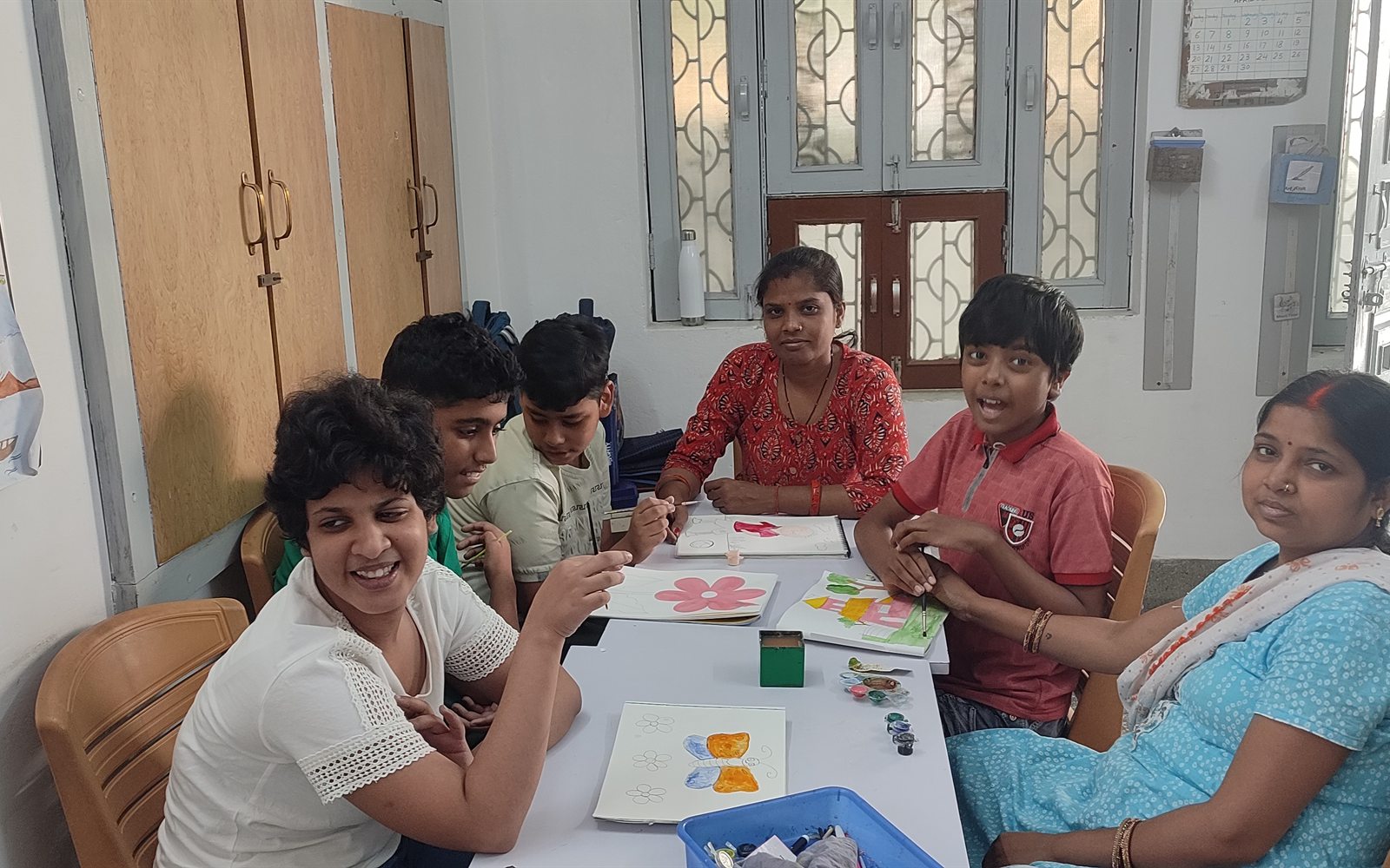 Group art and craft session with older students and teachers at ArambH
