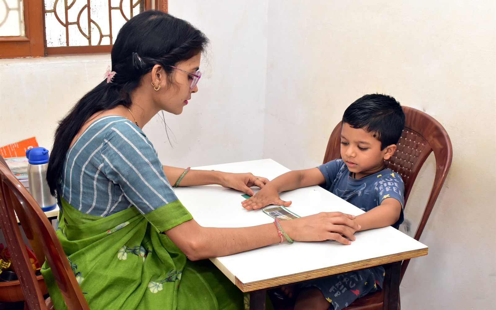 Speech therapy session with picture cards